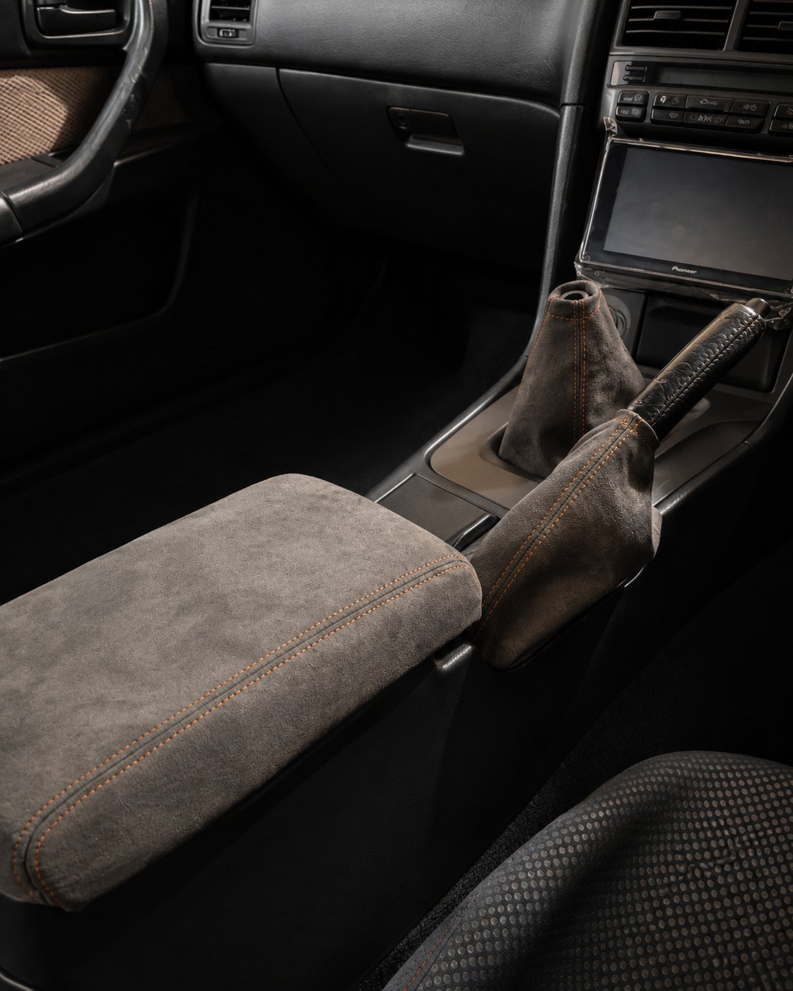 Graphite and bronze Nissan Skyline R34 interior trim set installed in the centre console