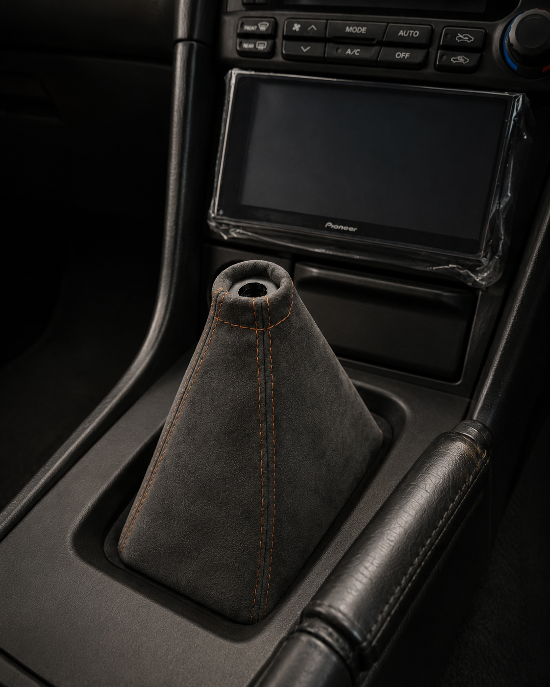 Graphite and bronze R34 shift boot installed in the original centre console